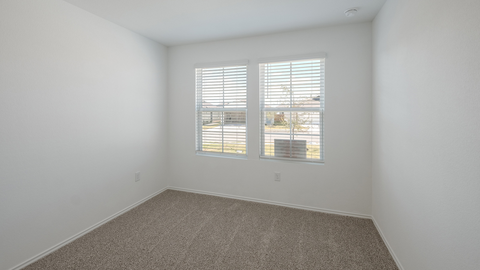 Bedroom 2 with carpeted floors.