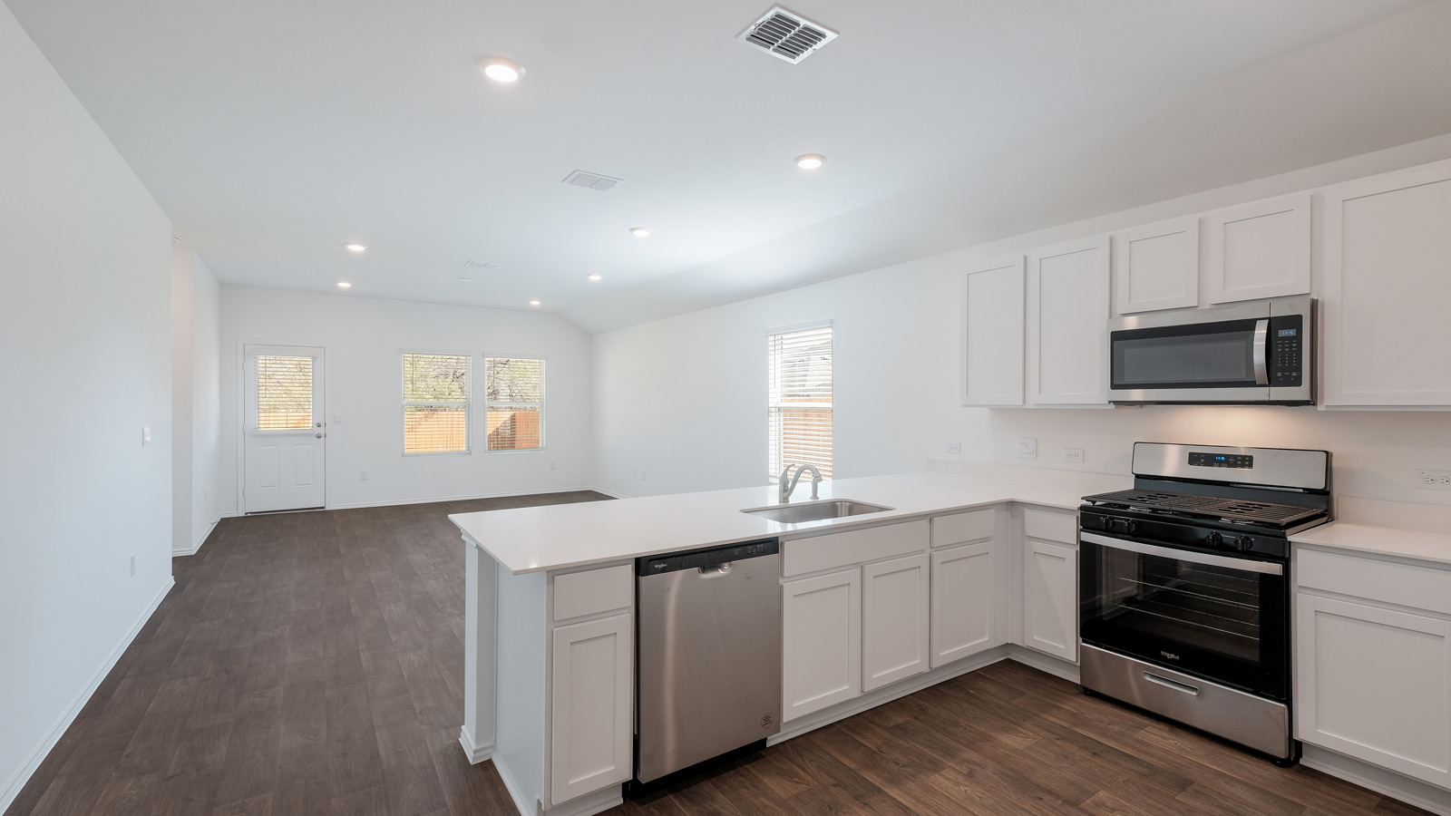 Gourmet kitchen with quartz countertops.