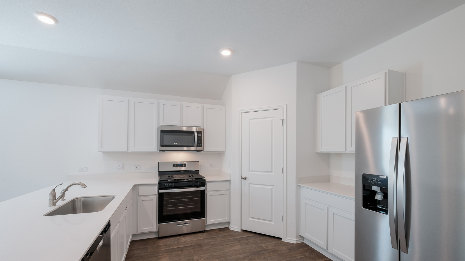 Stainless steel appliances in kitchen.