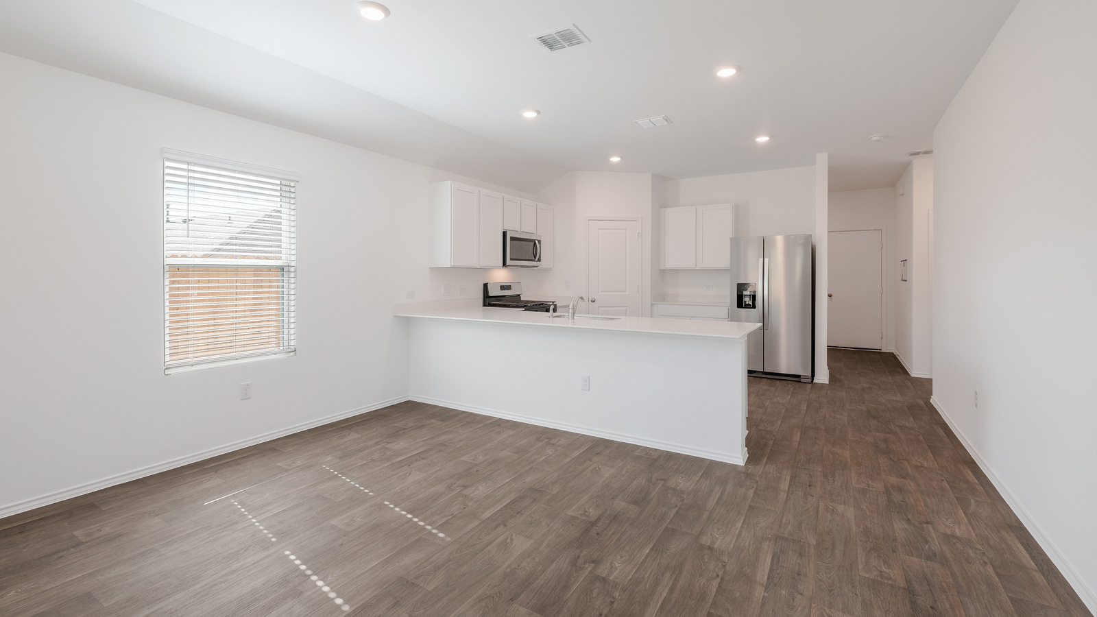 Open concept living room and kitchen.