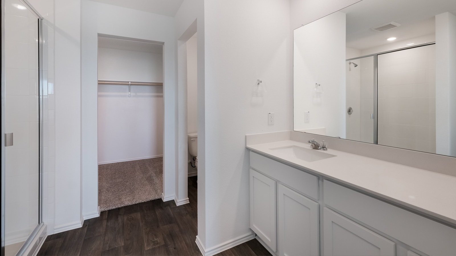Bathroom 1 with single vanity sink and walk-in shower.