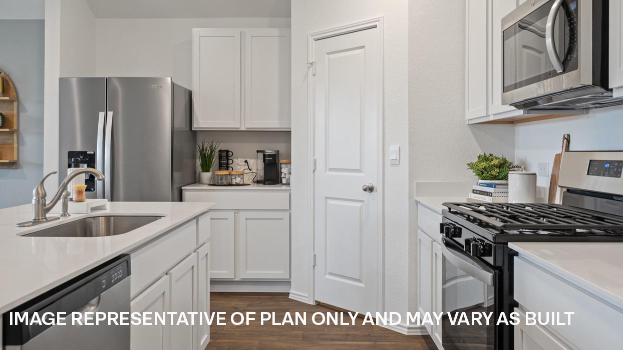 Modern kitchen with stainless steel range, microwave, and dishwasher.