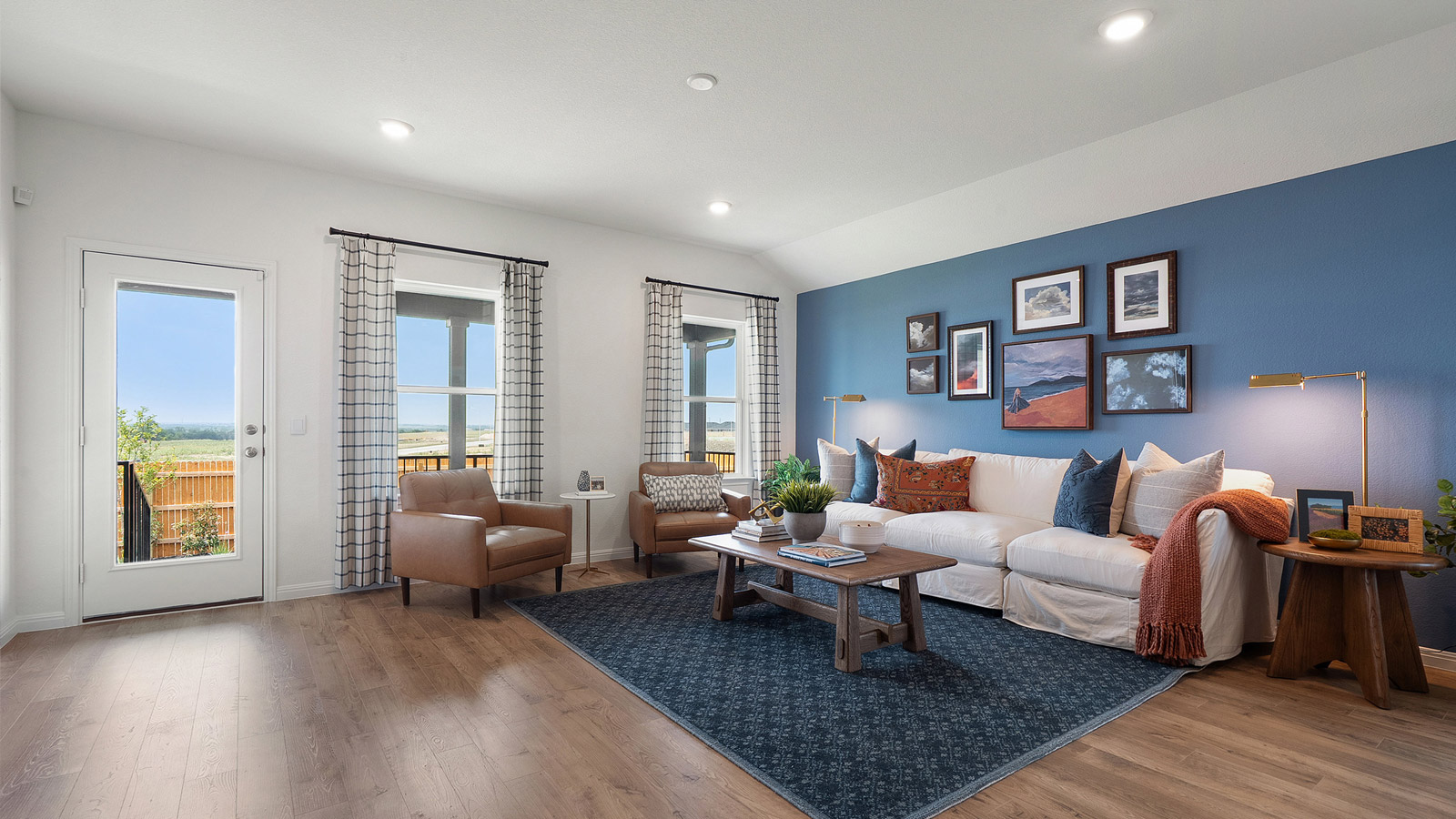 Interior living area with accent wall and windows