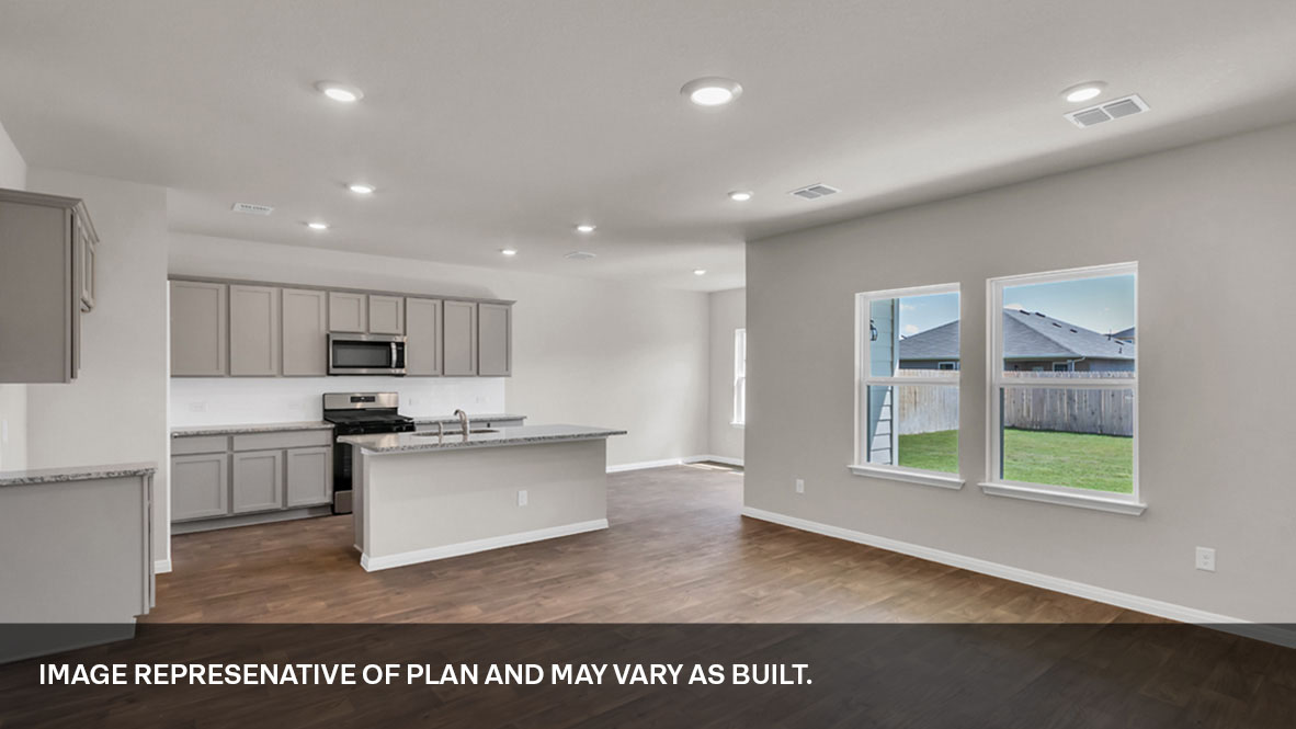 Interior kitchen with center island and light grey cabinets
