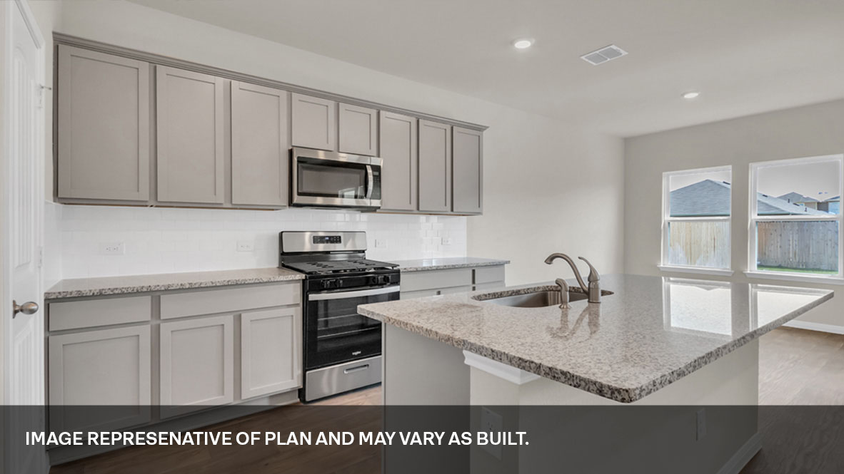 Interior kitchen with center island and light grey cabinets