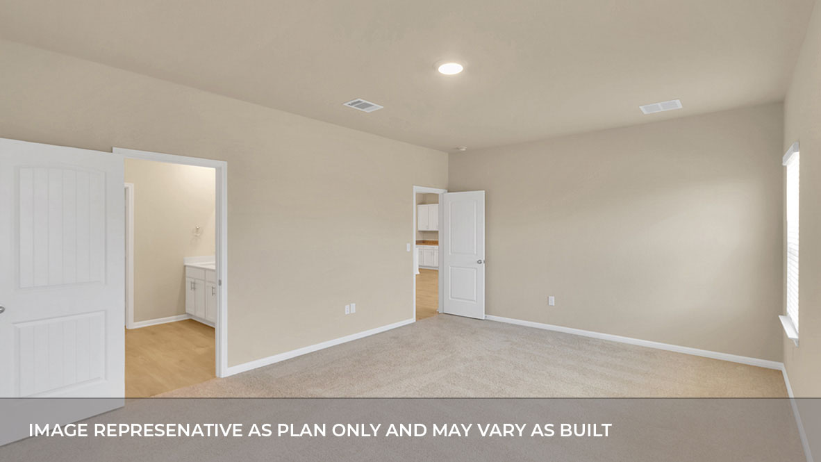 Interior primary bedroom with windows and bathroom
