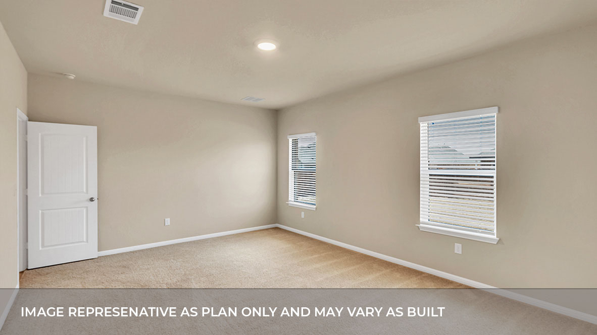 Interior primary bedroom with windows