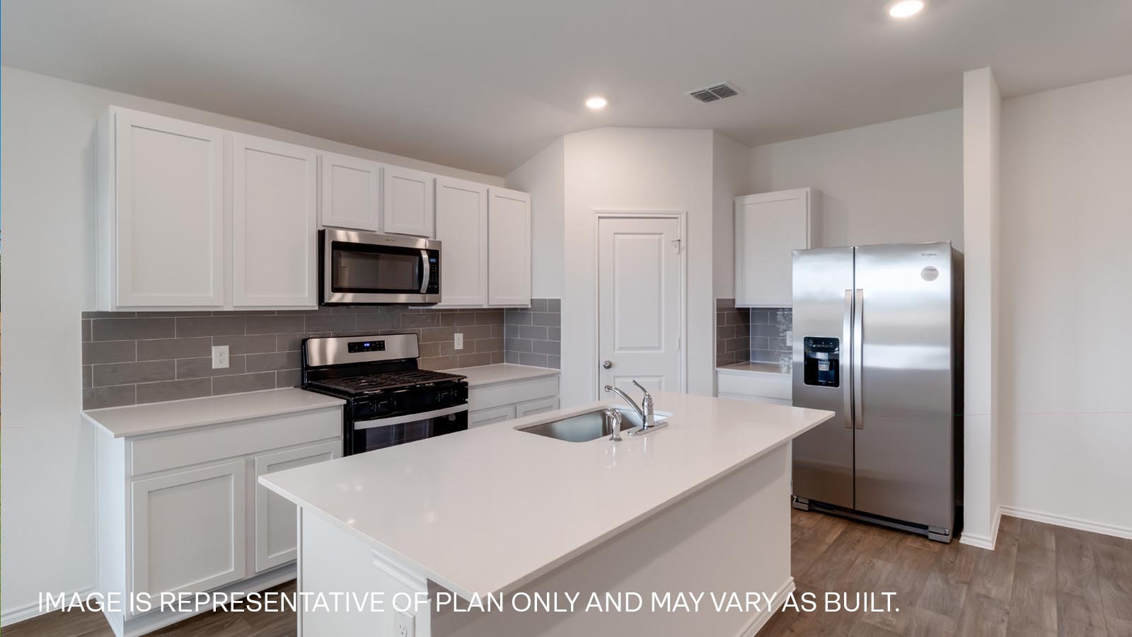 Modern kitchen with quartz countertops.