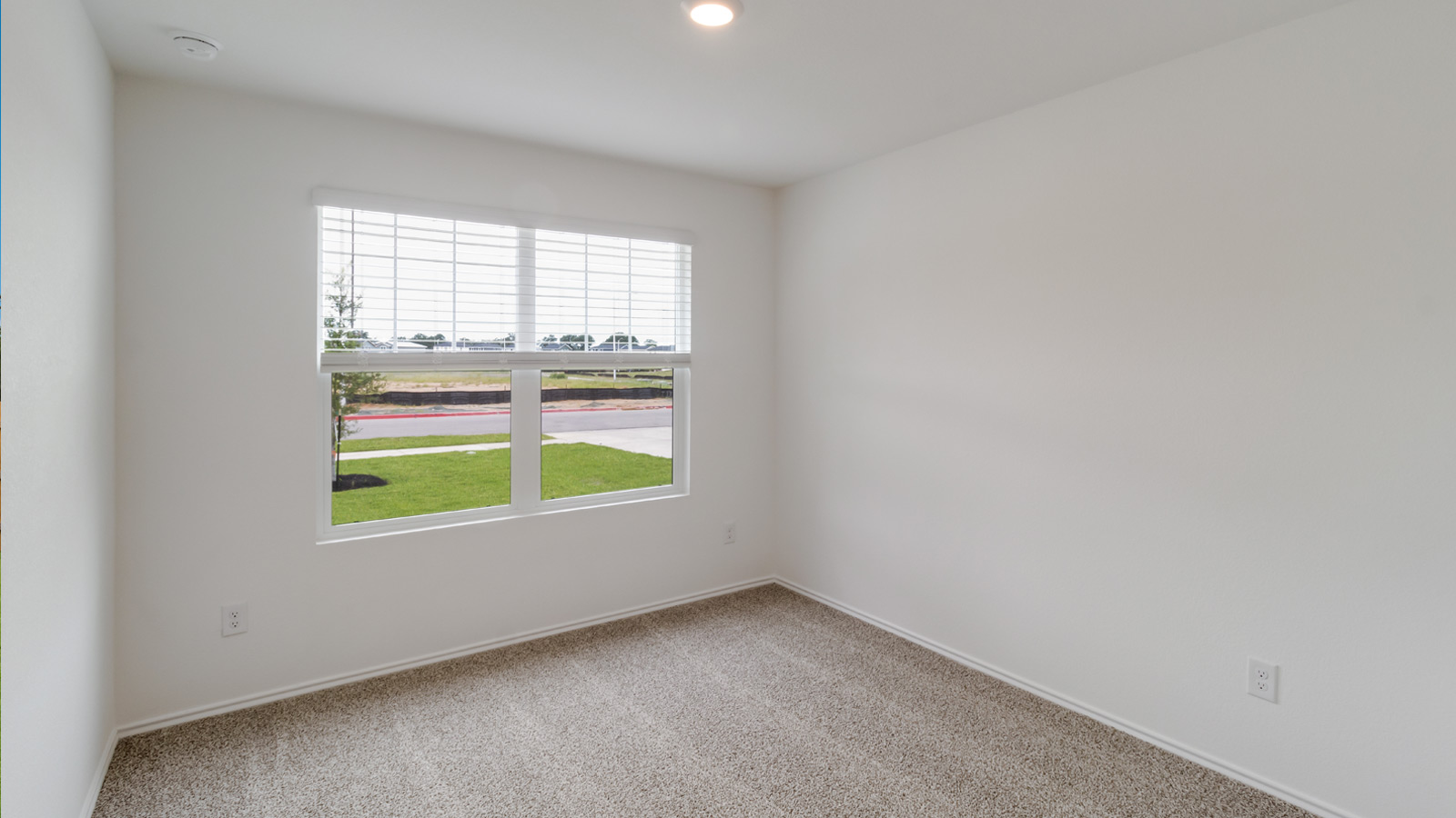 Berdroom 3 with carpeted flooring.