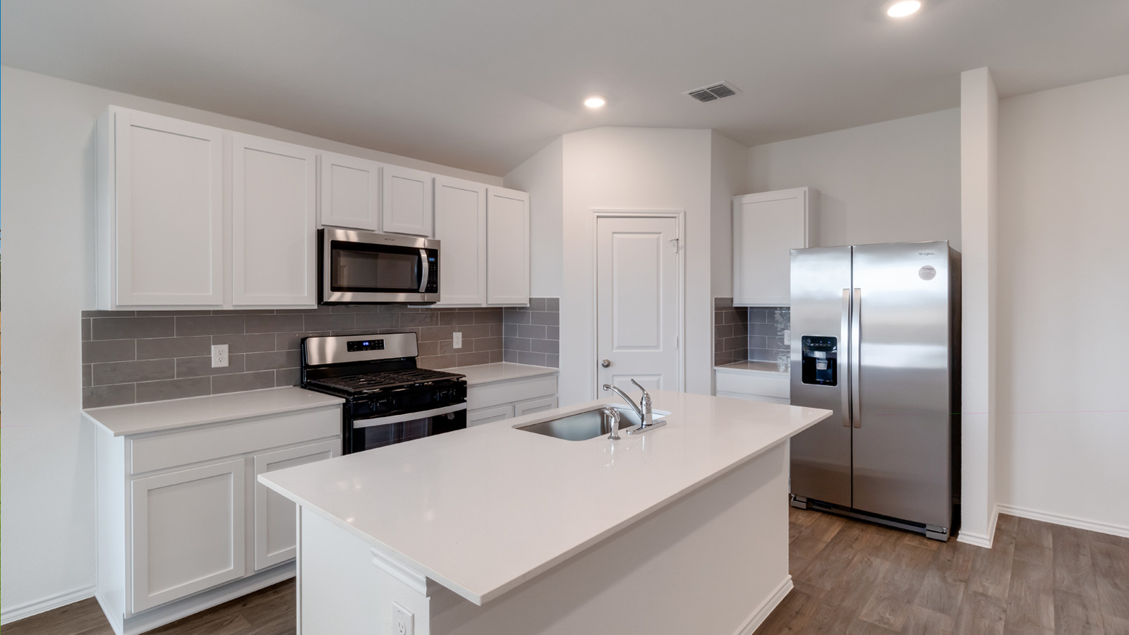 Kitchen with stainless steel appliances.