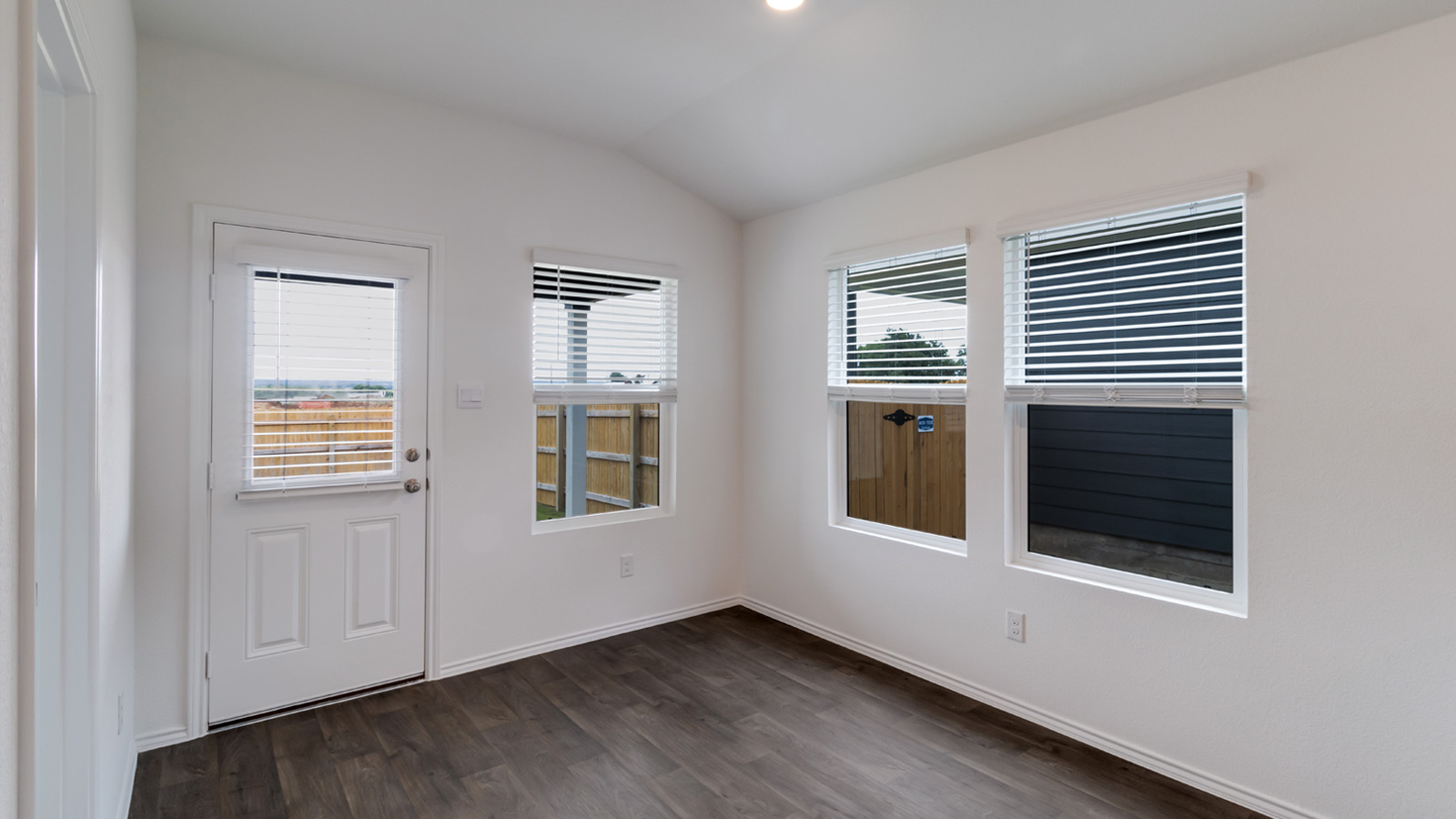 Dining area with view of backyard.