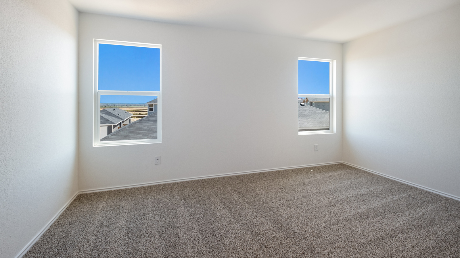 Owner’s suite offers natural window light, spa-inspired ensuite bathroom, backyard view, walk-in closet for everyday style