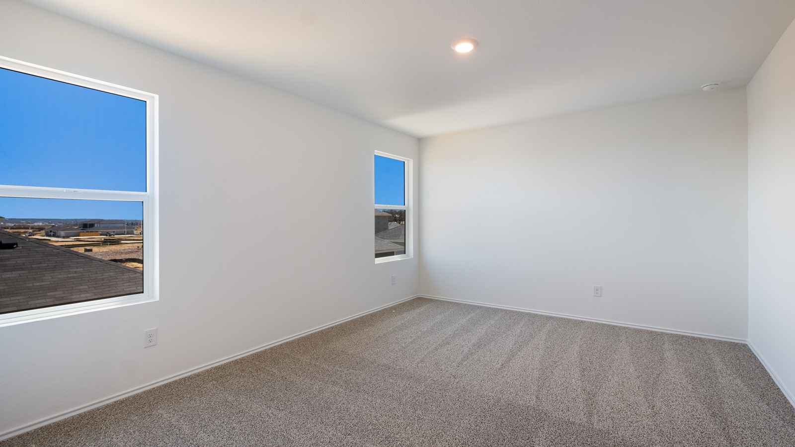 Primary bedroom designed with privacy and space in mind with a flow into a spa-inspired ensuite bathroom and walk-in closet