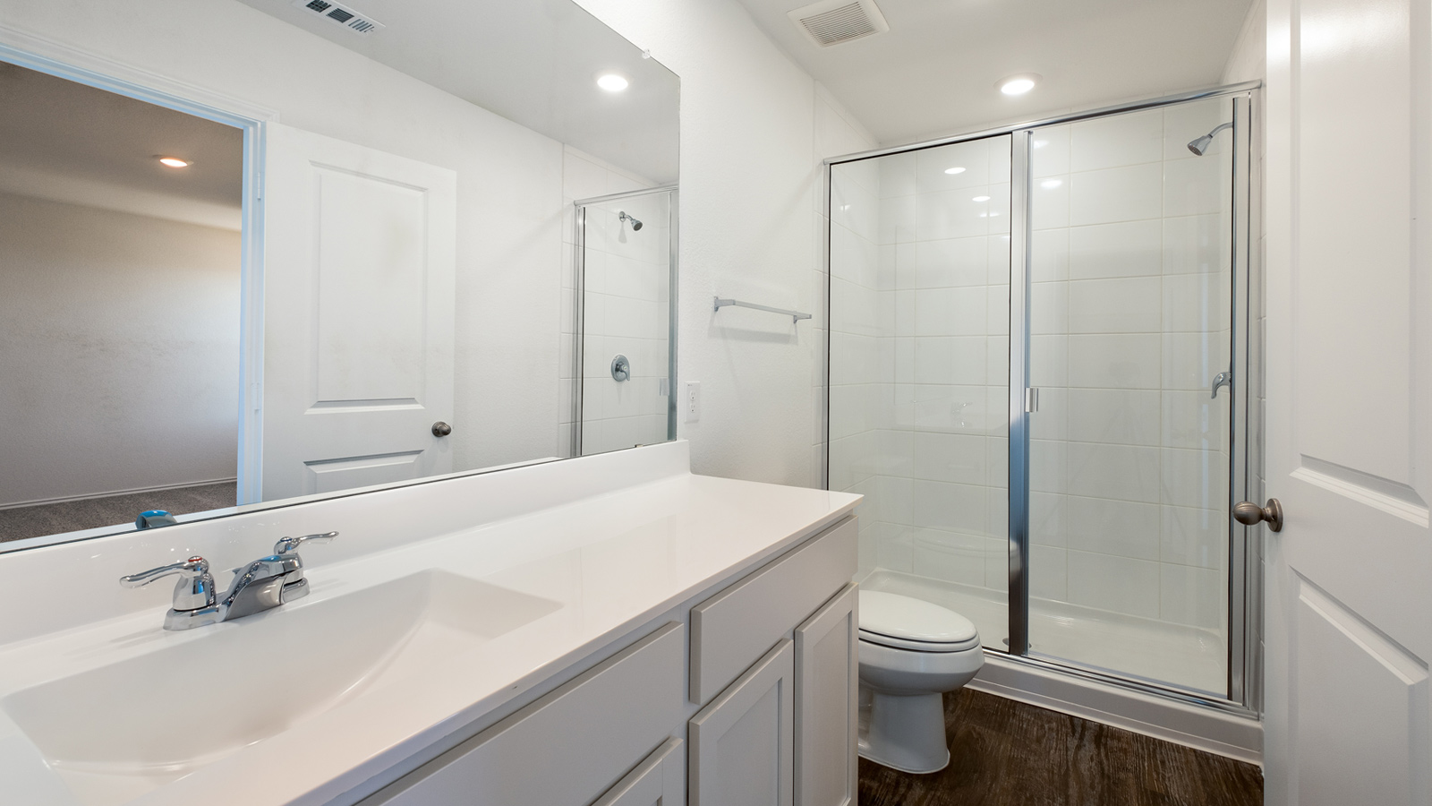 Owner’s ensuite in a new build home offers function and style with a walk-in closet, spa-like ensuite