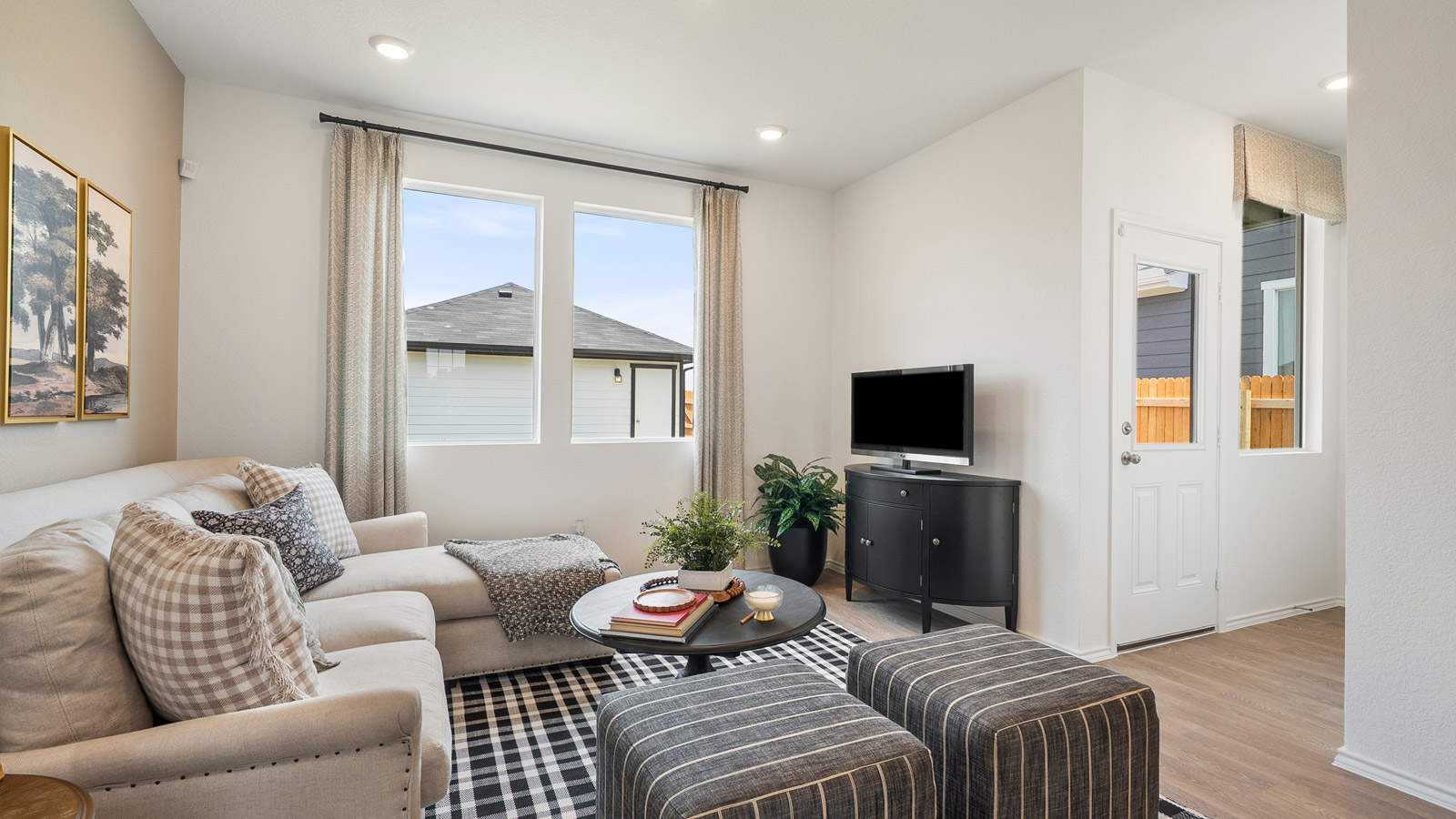 Interior living room with large windows next to front door
