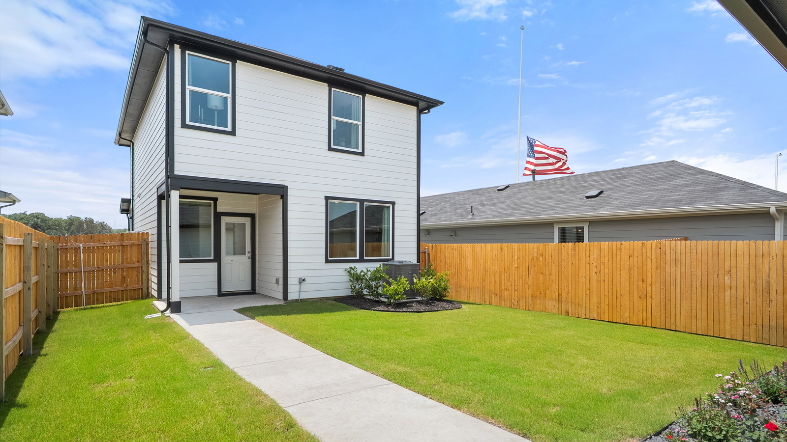 Exterior of back yard showing back porch of house