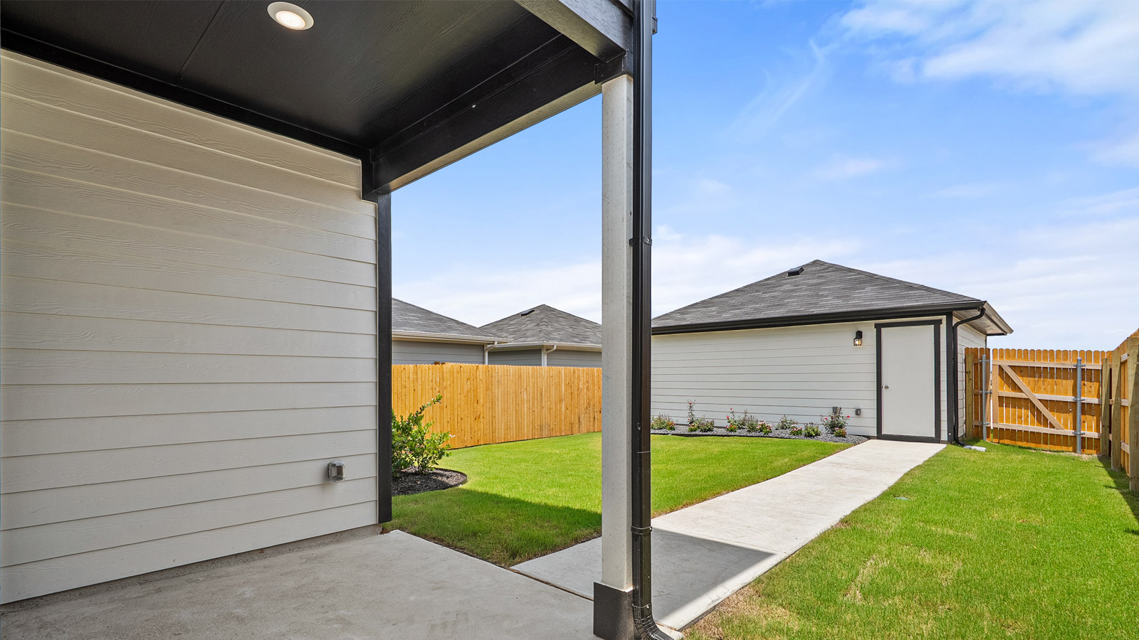 Exterior of back yard showing storage in the back