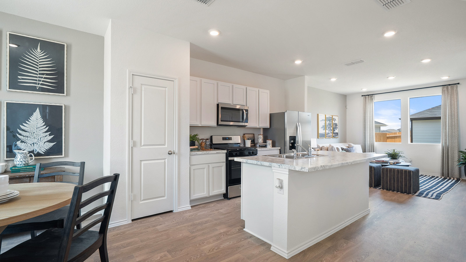 Interior kitchen with white cabinets and large central island