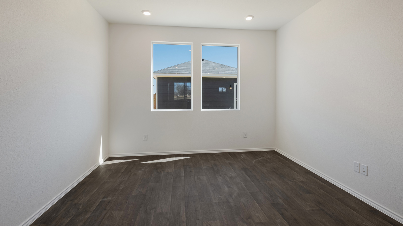 Living area with two large windows.