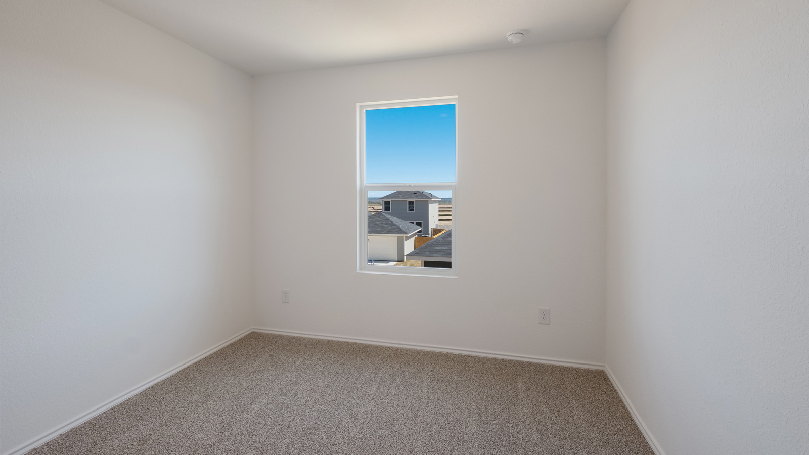 Bedroom 2 with carpeted floors.