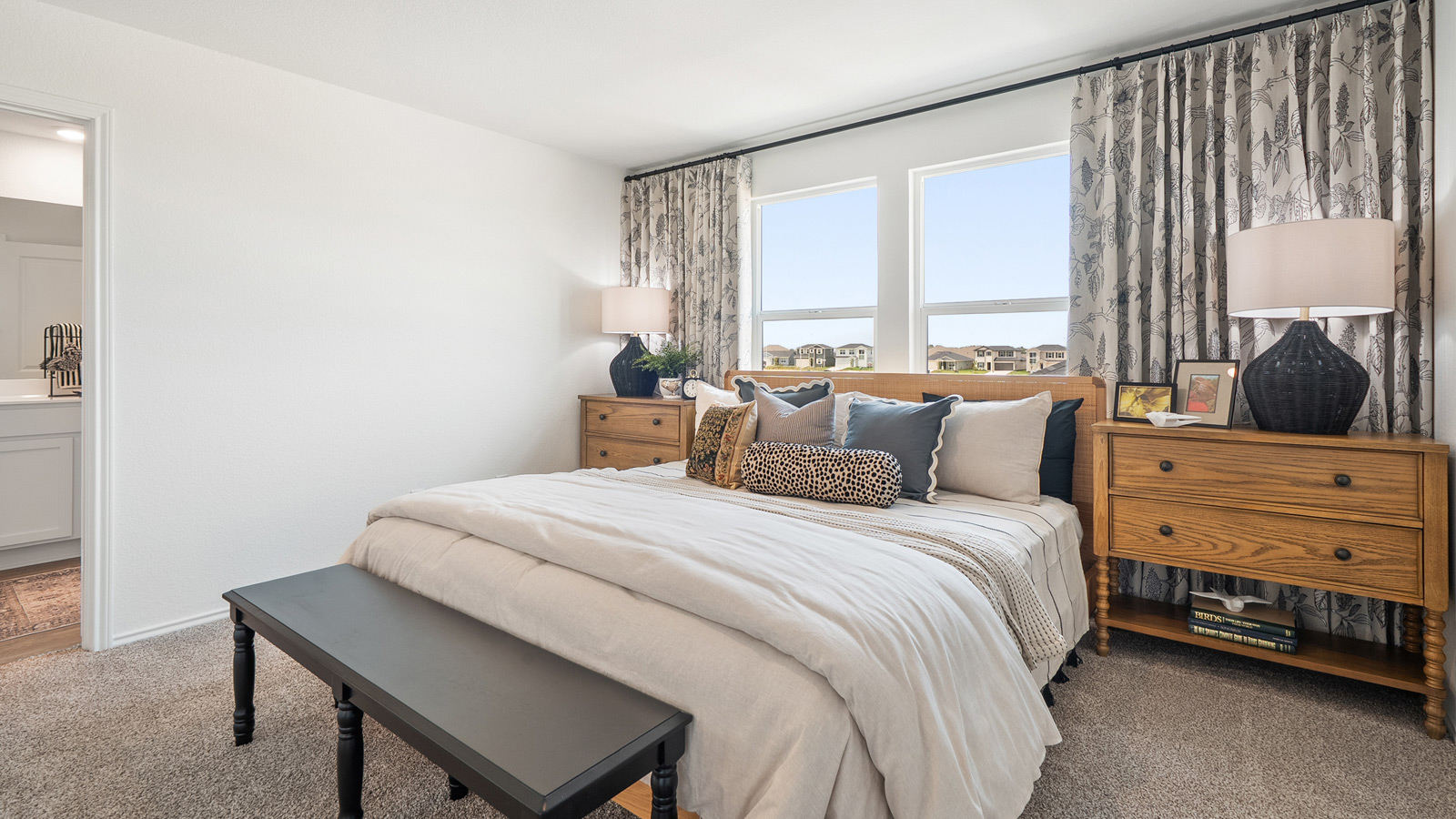 Interior of bedroom with large windows