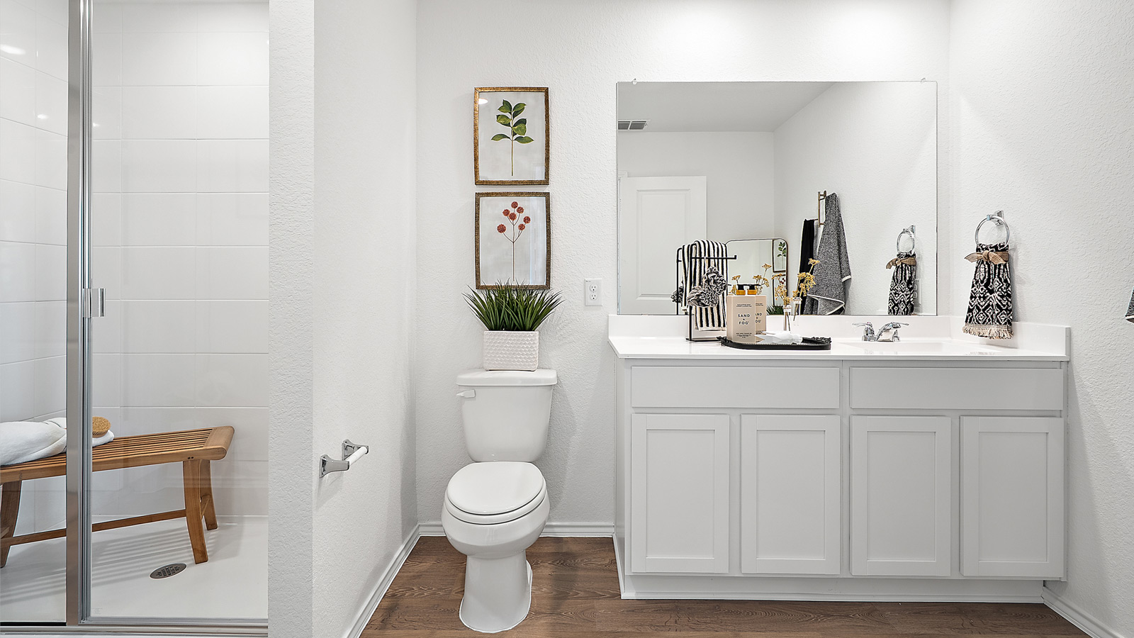 Interior bathroom with walk in shower and large vanity