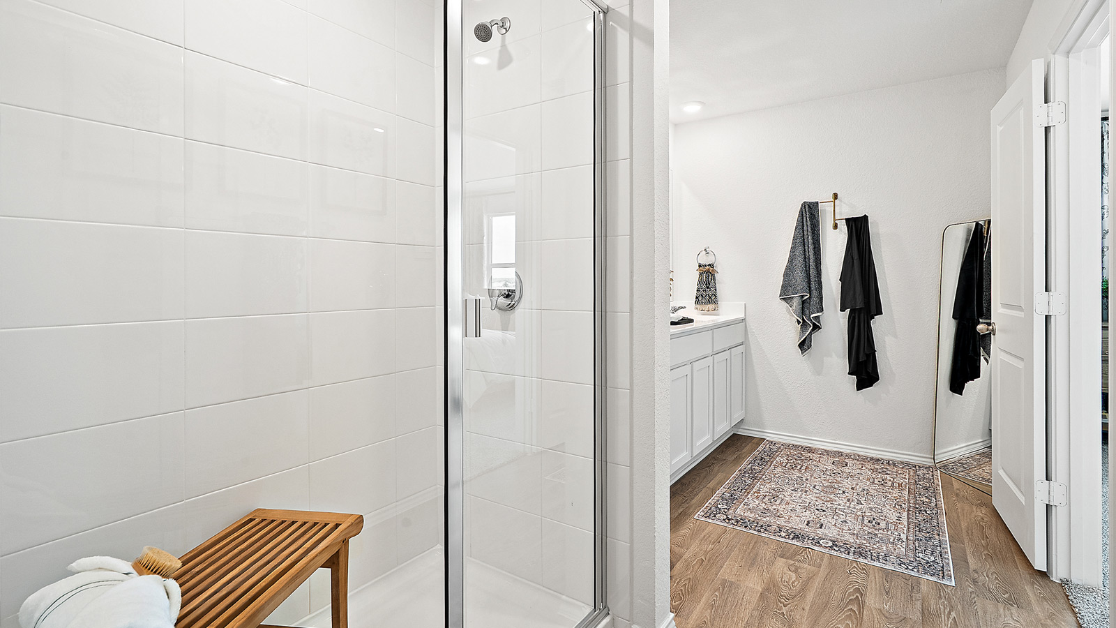 Interior bathroom with walk in shower and large vanity