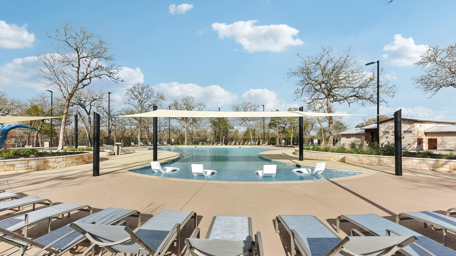 Pool with tanning ledge at Valverde amenity center.