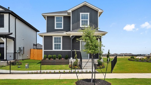 Exterior of two story home with grey wood cladding
