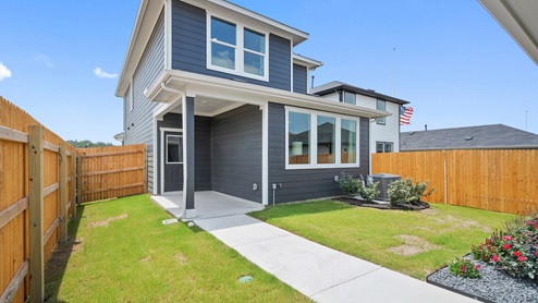 Exterior of back yard showing back porch of house