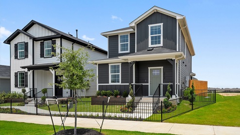 Exterior of two story home with grey wood cladding