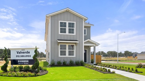 Exterior of two story home with grey wood cladding