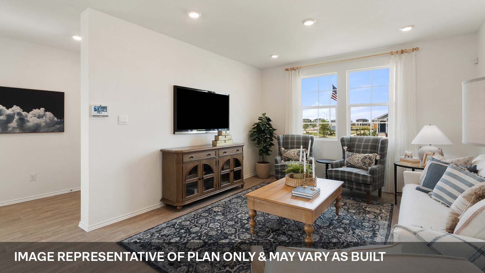 Open concept living area with two windows.