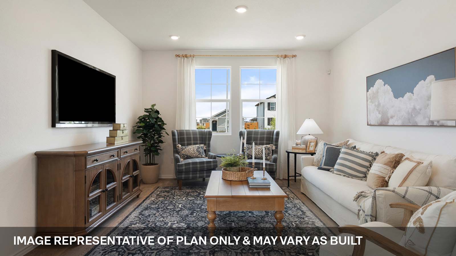 Open concept living area with two windows.