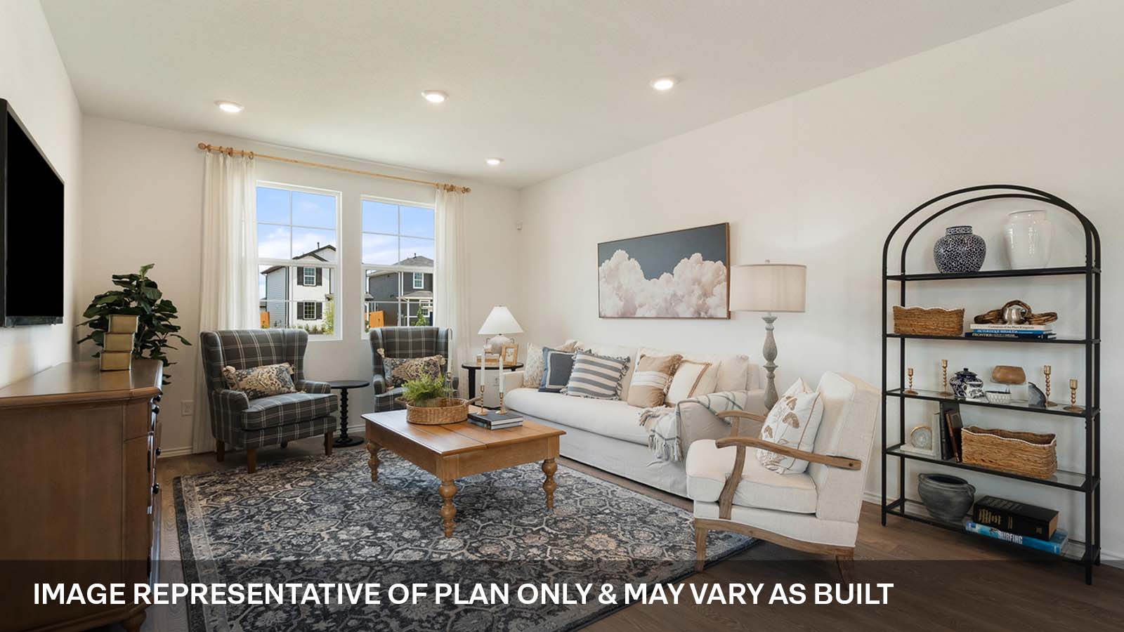 Open concept living area with two windows.