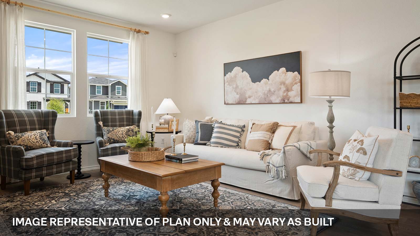 Open concept living area with two windows.