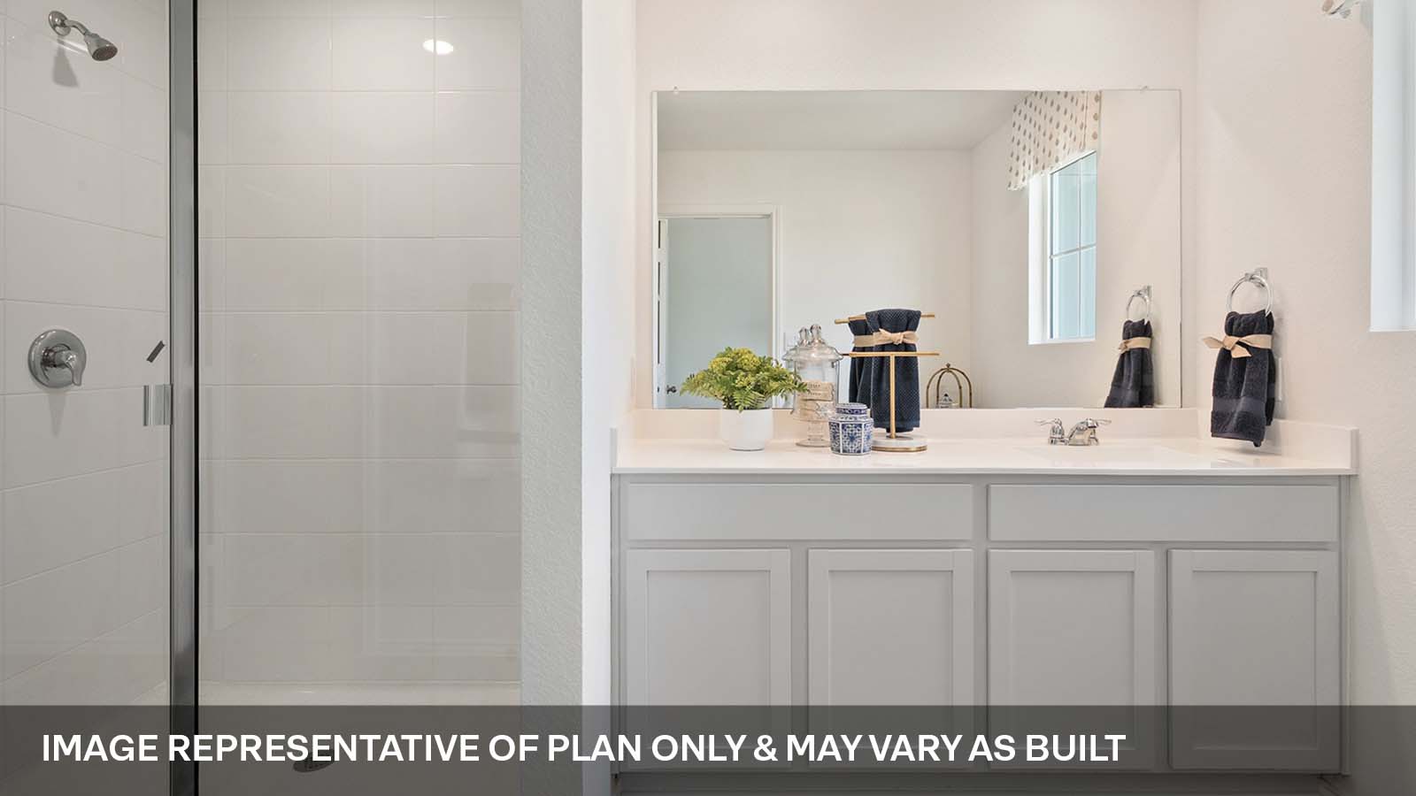 Primary bathroom with quartz vanity sink and walk-in shower.