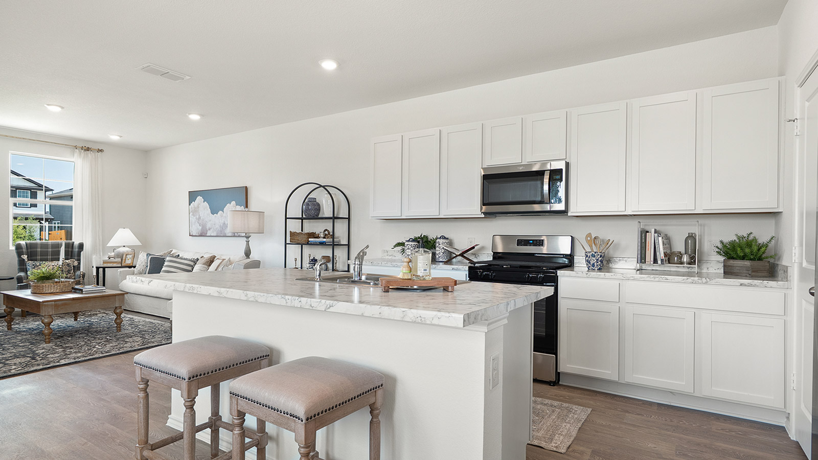 Interior kitchen with white cabinets and large central island