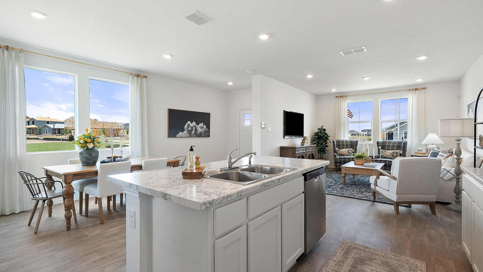 Interior kitchen with white cabinets and large central island