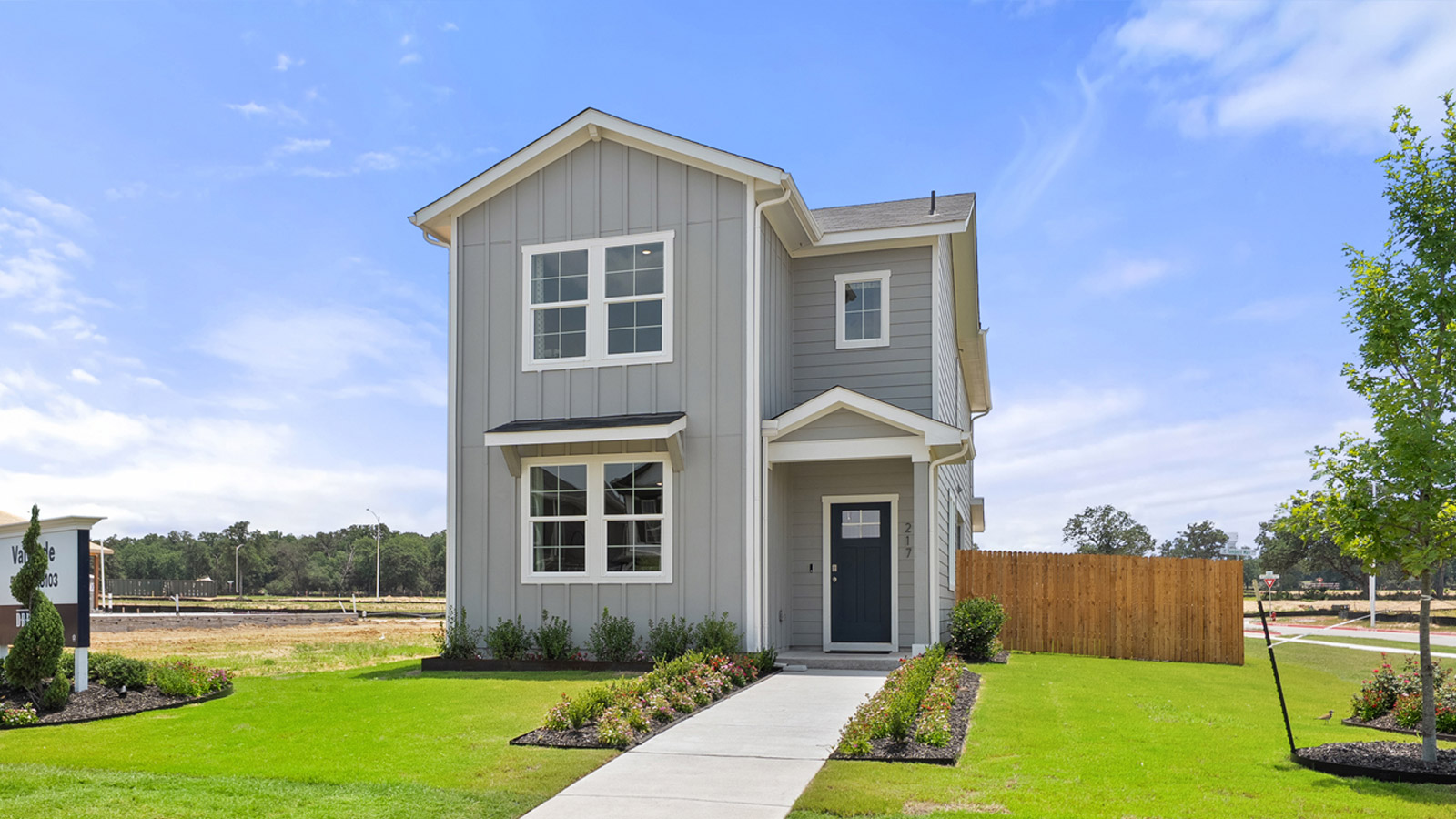 Exterior of two story home with grey wood cladding