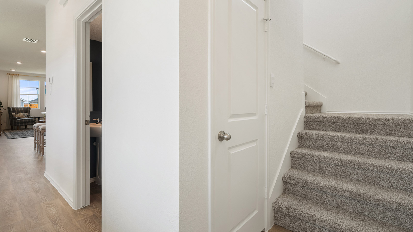 Interior stairway that has closet and bathroom next to it