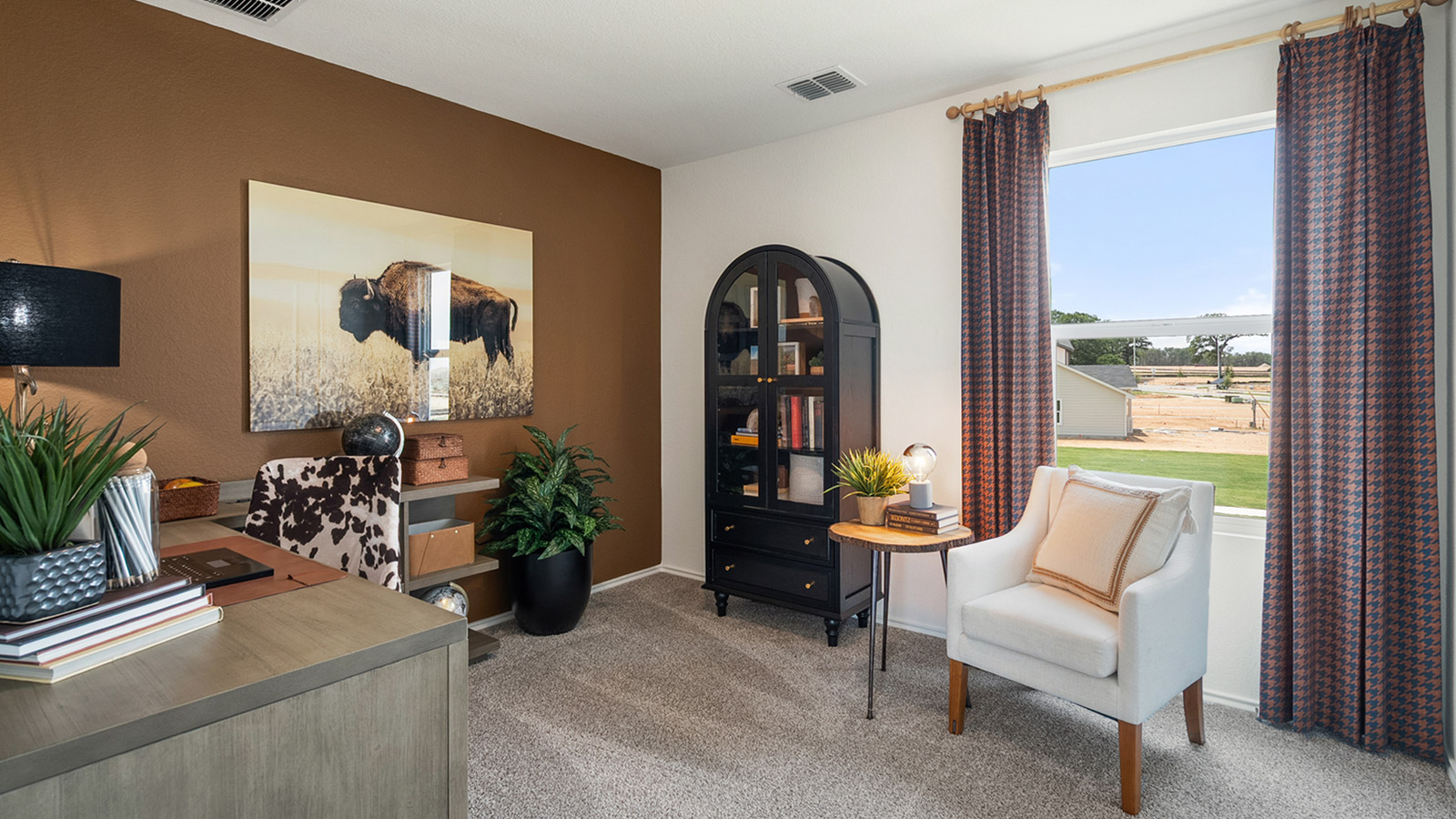 Interior bedroom with large windows and a private bathroom