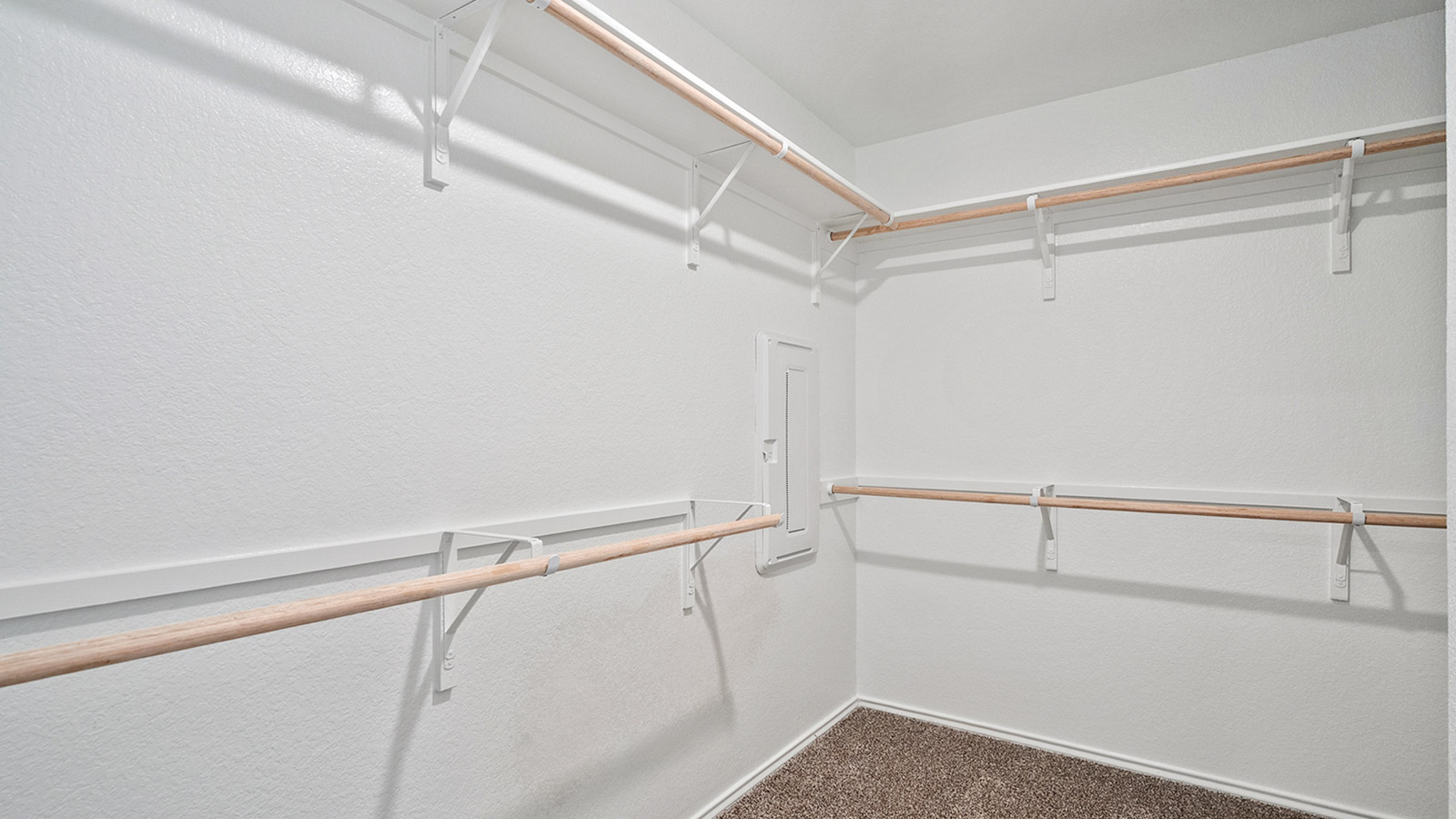Interior walk in closet with built in shelving