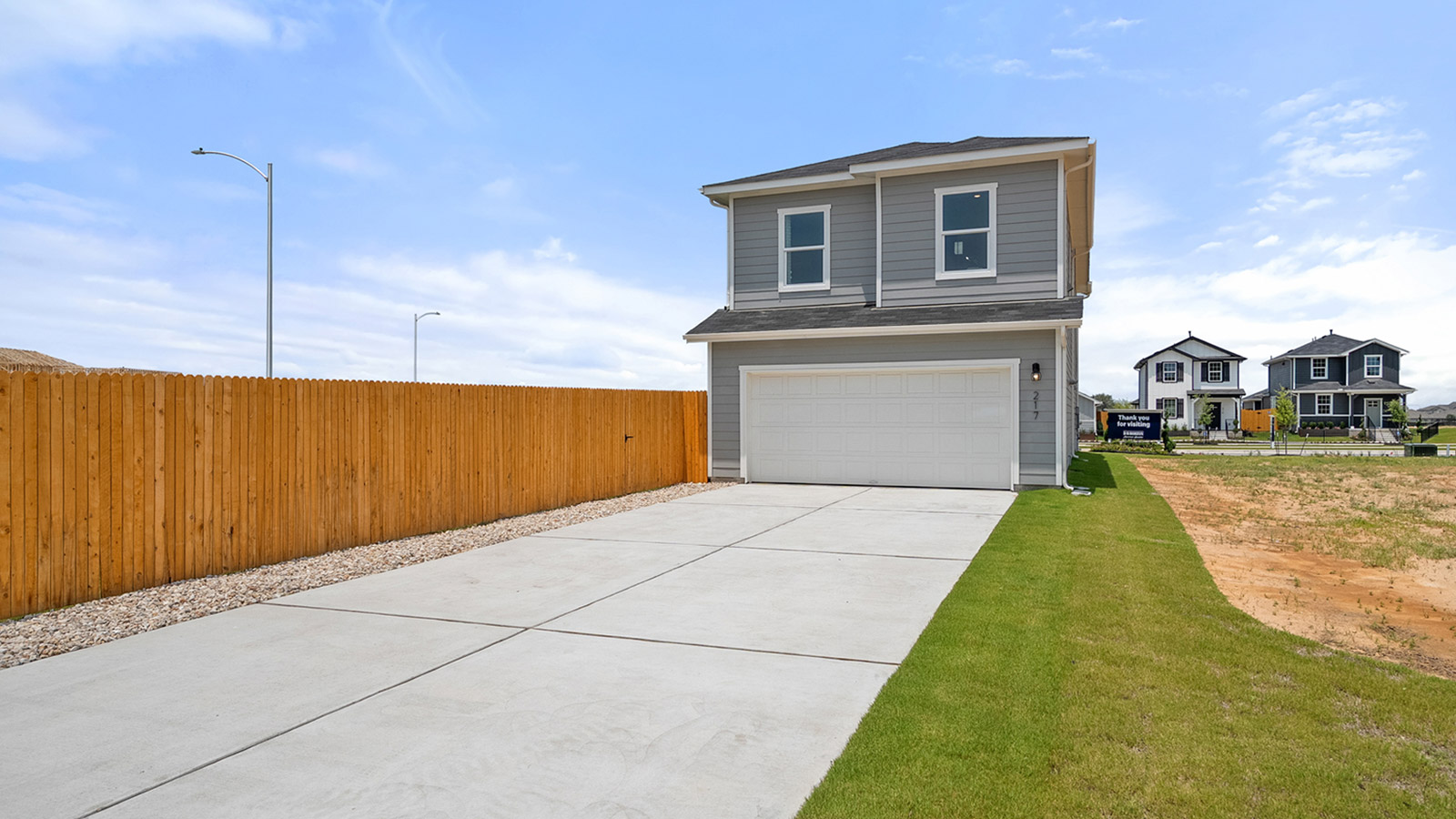 Exterior of back of home with two car garage
