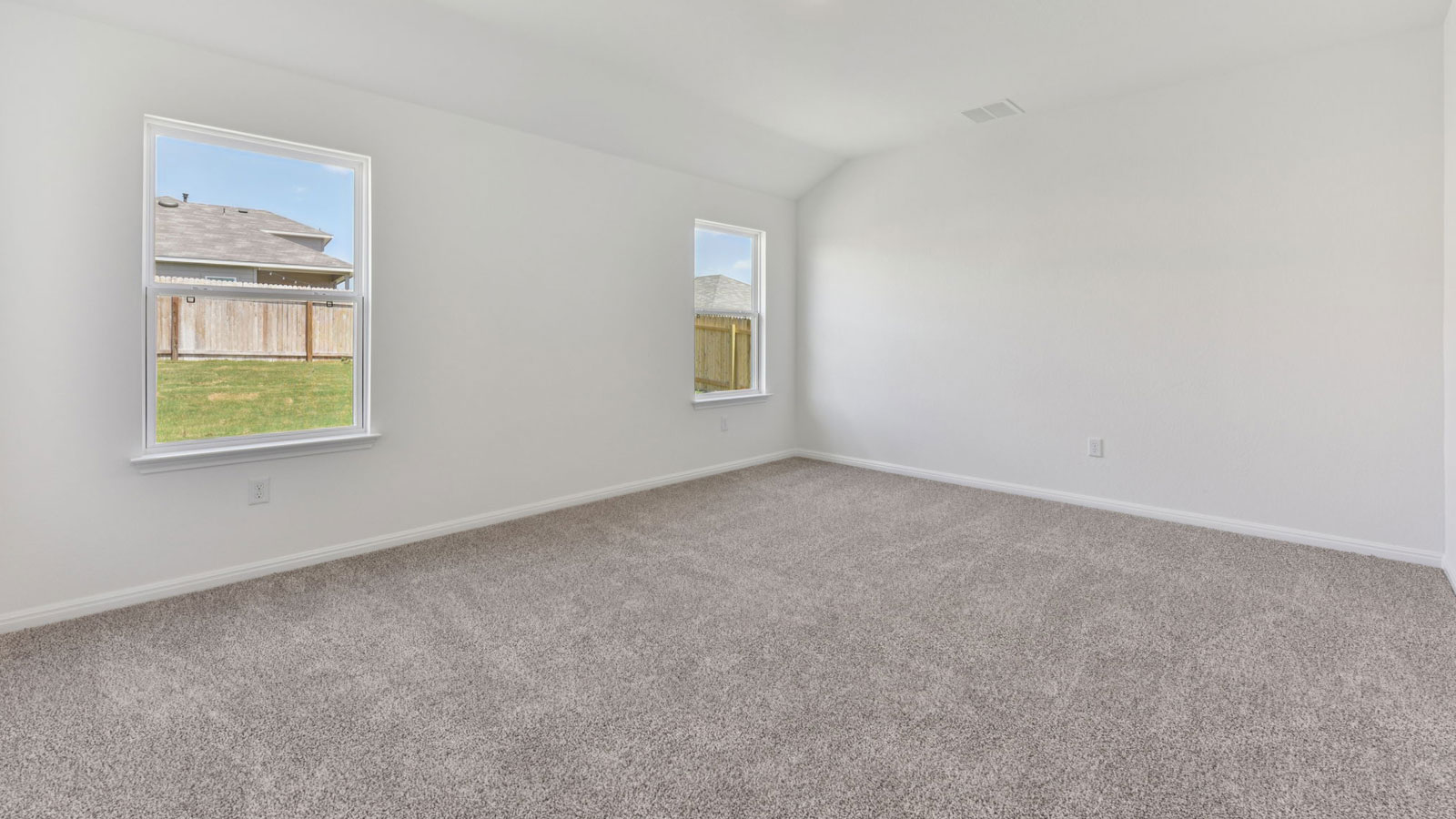 Primary Bedroom with carpeted flooring.