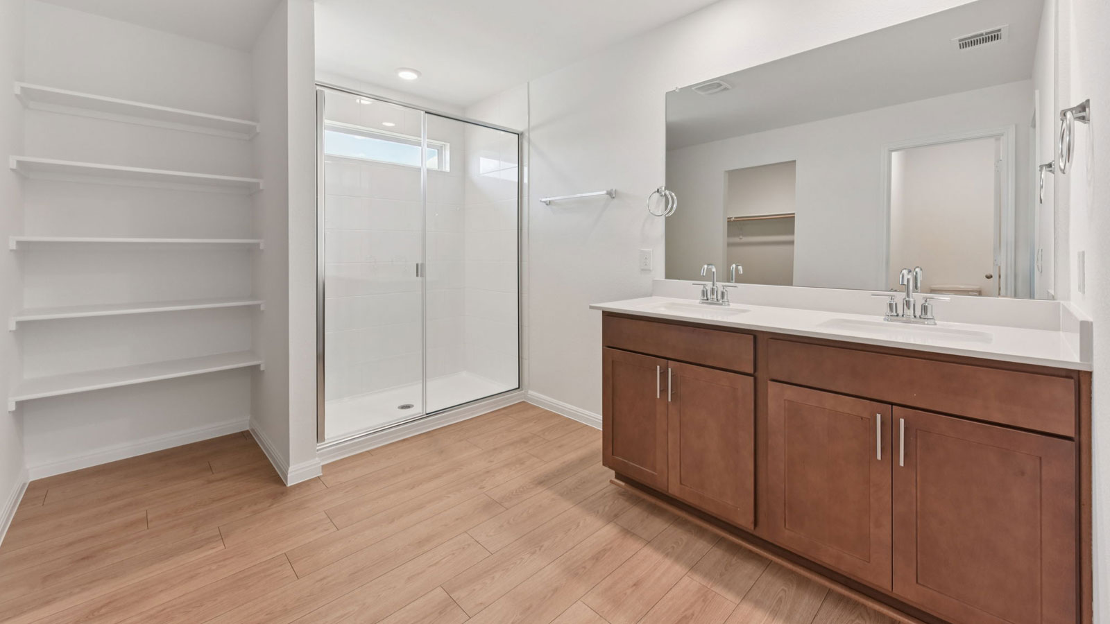 Luxurious primary bathroom with walk-in shower.