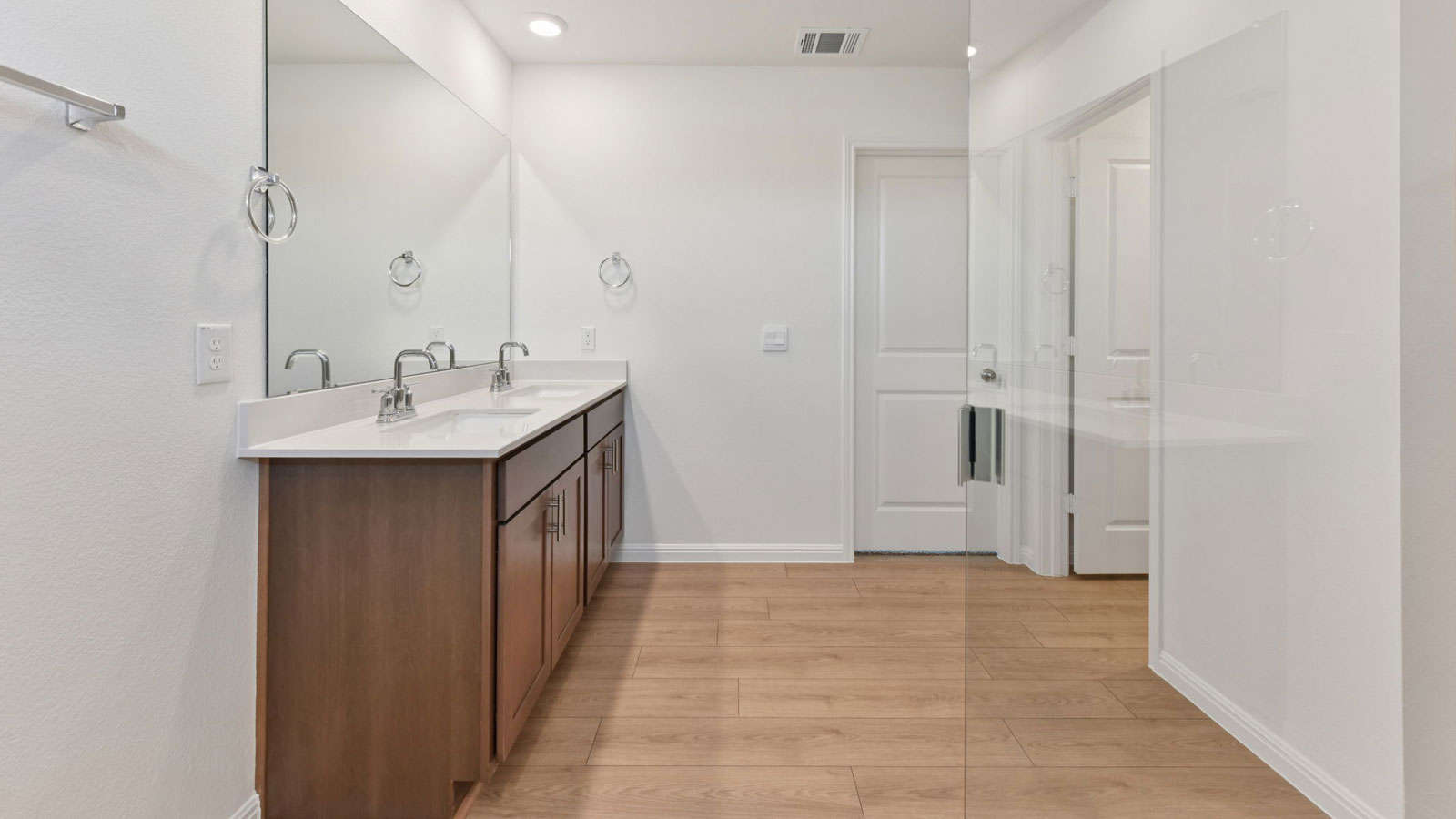 Luxurious primary bathroom with walk-in shower.
