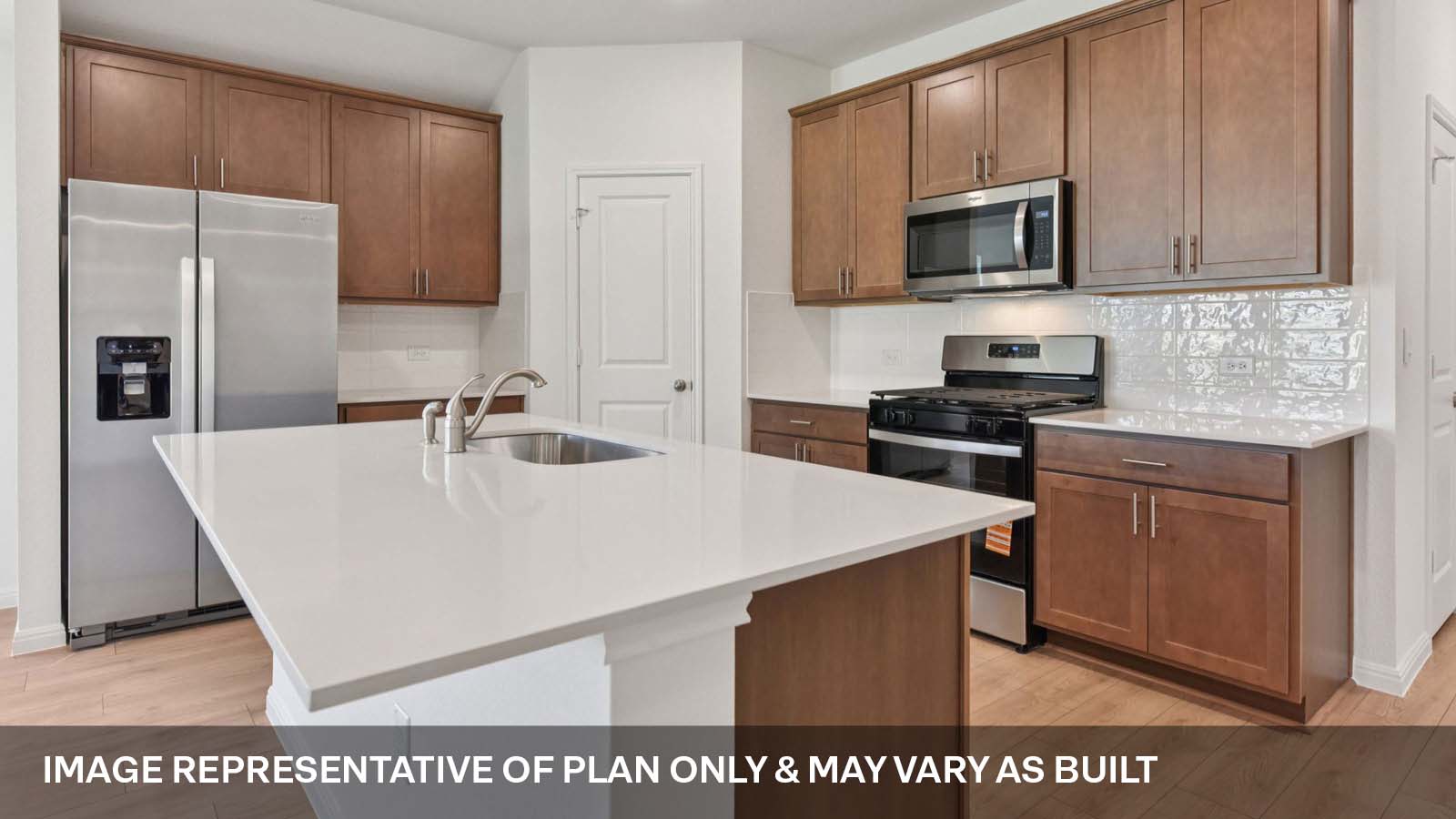 Quartz countertops and stainless steel gas range microwave.