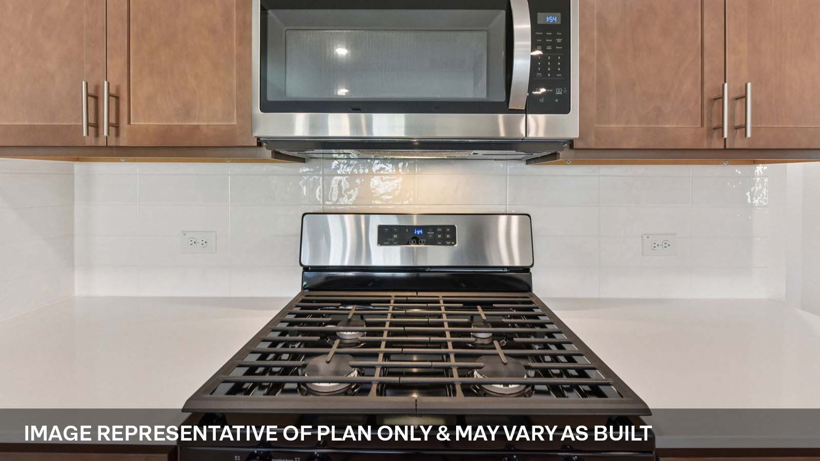 Stainless steel gas range and microwave.