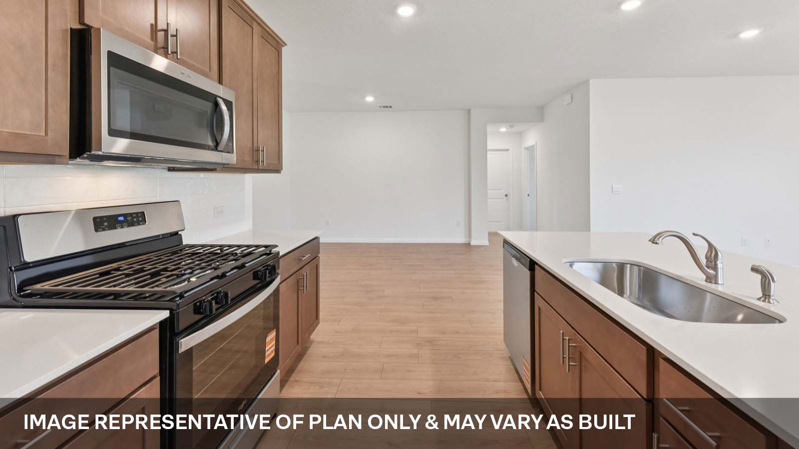 Kitchen island with single bowl undermount sink.